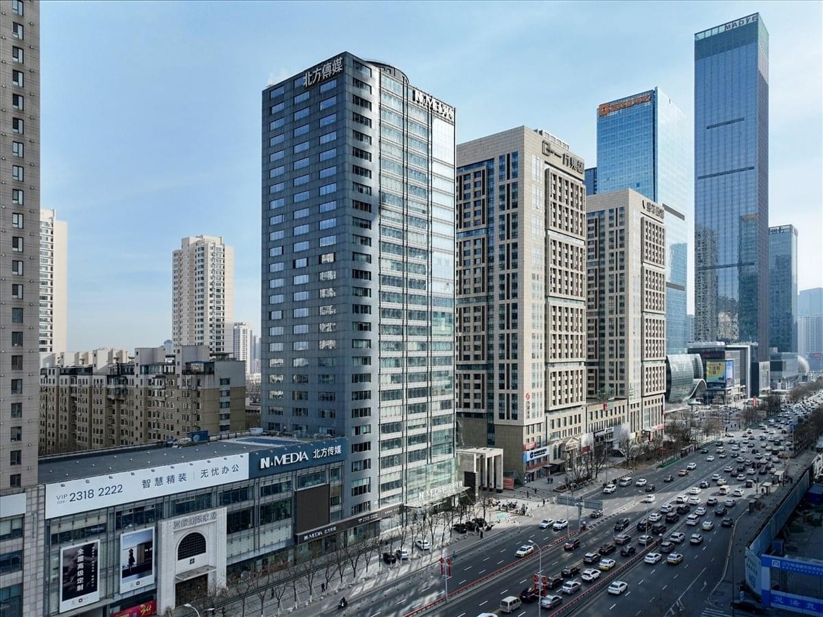 Exterior view of the high-rise glass building at 167 Qingnian Street.