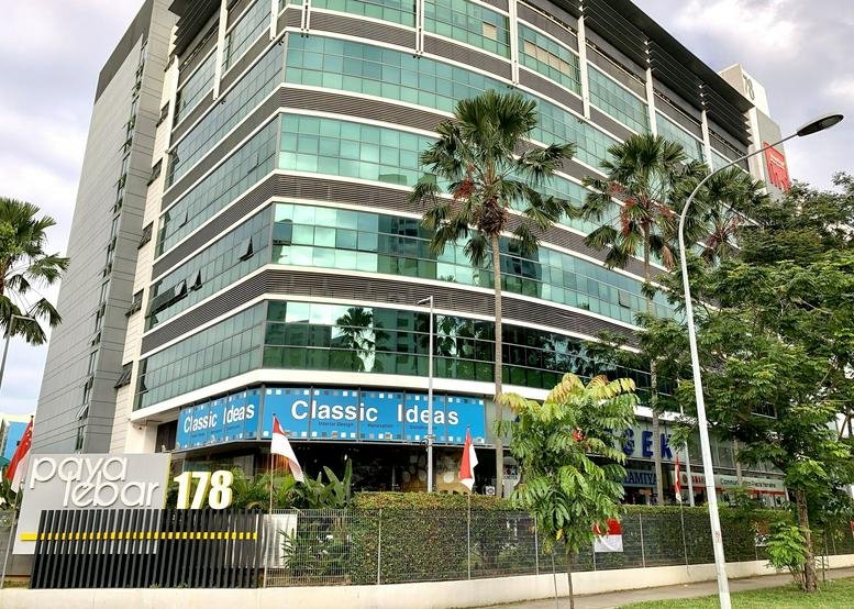 Exterior view of the multi-story glass facade building at 178 Paya Lebar Road.