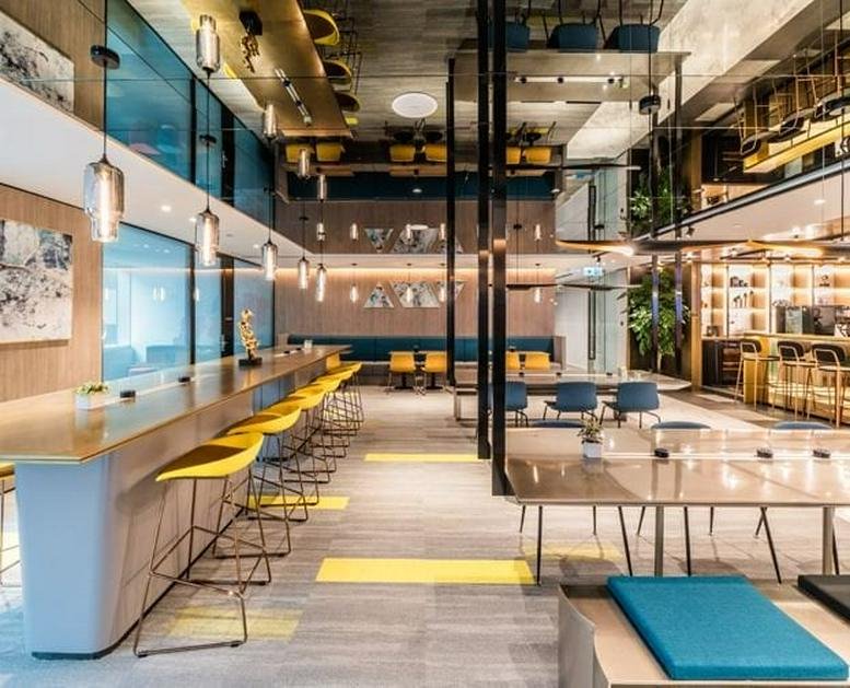 Spacious communal lounge and cafe area at Shenzhen Dinghe Tower with bar seating and modern lighting.
