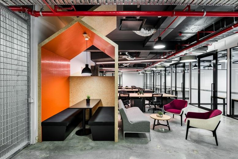 Spacious communal lounge at 191, Saint Georges Terrace, Perth with a house-shaped booth and colorful seating.