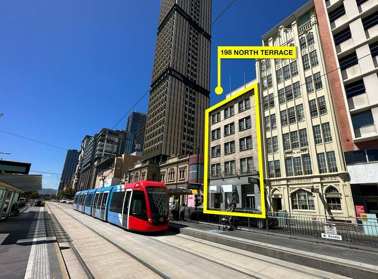 Exterior view of the multistory building at 198 North Terrace, Adelaide, alongside a city tram.