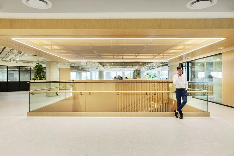Wide interior view of the modern, light-filled office mezzanine at Paya Lebar Quarter 3.