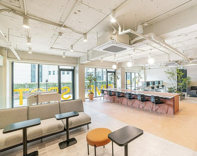 Spacious open-plan coworking area at 20 Wausan-ro 23-gil, Hongdae 2 with long communal desks and natural light.