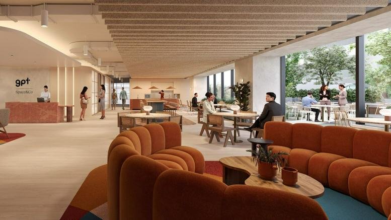 Spacious sunlit lounge and reception area at 201 Sussex Street with curved orange sofas and wood panelled ceiling.