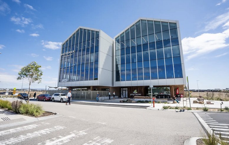 Modern dual-peaked glass facade at 21 Cityside Drive, Level 3.