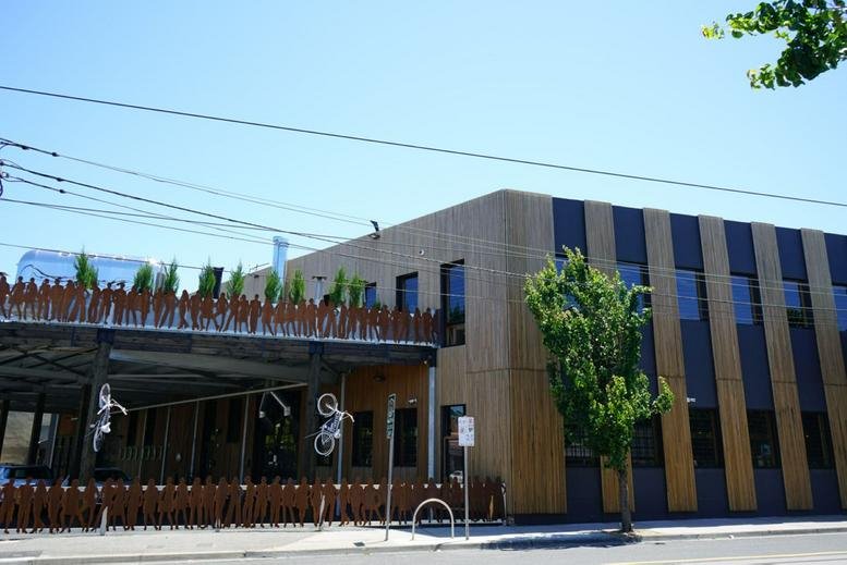 Exterior view of the wood-paneled building facade at 22 Church Street.