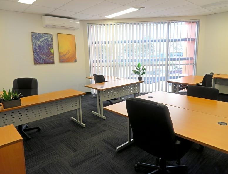 Exterior view of Australian Adventure Vehicles building with parking area.