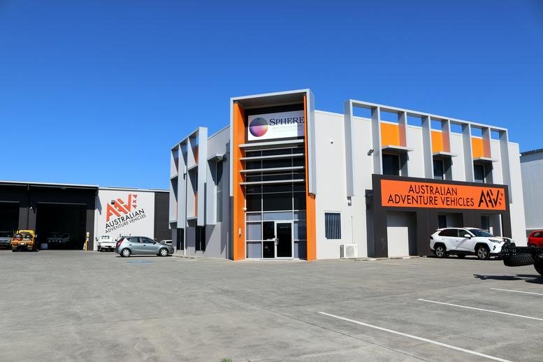 Exterior view of the professional office building at 221, Leitchs Road, Brendale with orange accents.
