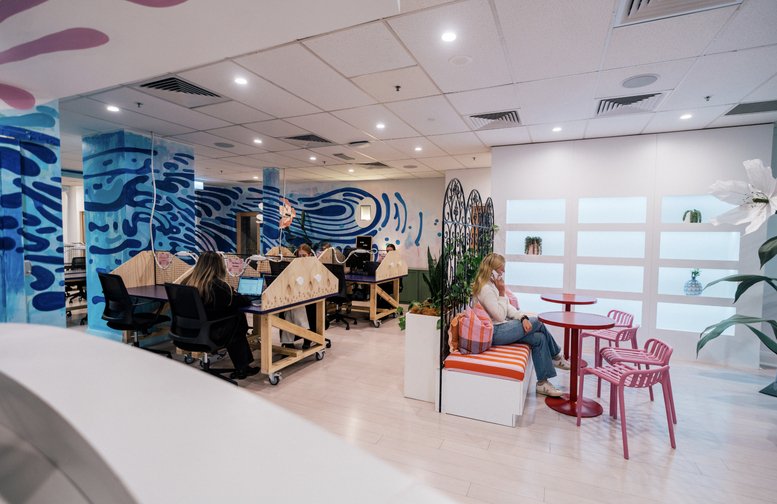 Wide view of the vibrant common area and creative workspaces at Level 1, 222 Pitt Street, Sydney.