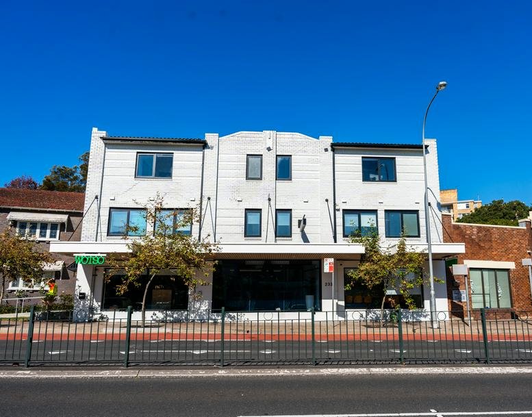 Exterior view of the white three-story building facade at 237 Military Road.