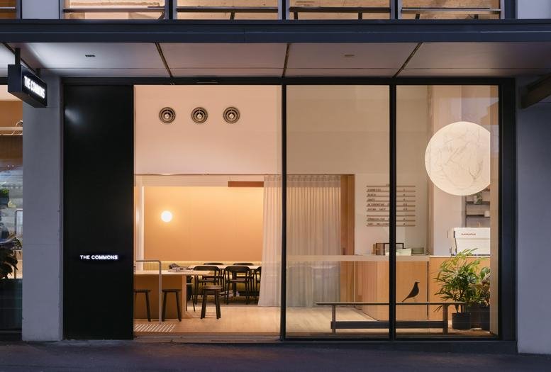 Exterior view of the modern glass-front entrance at 285a Crown Street, Surry Hills.