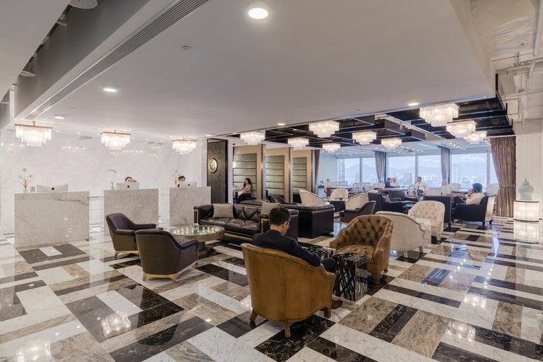 Spacious reception area with marble floors and lounge seating at Champion Tower, 3 Garden Road.