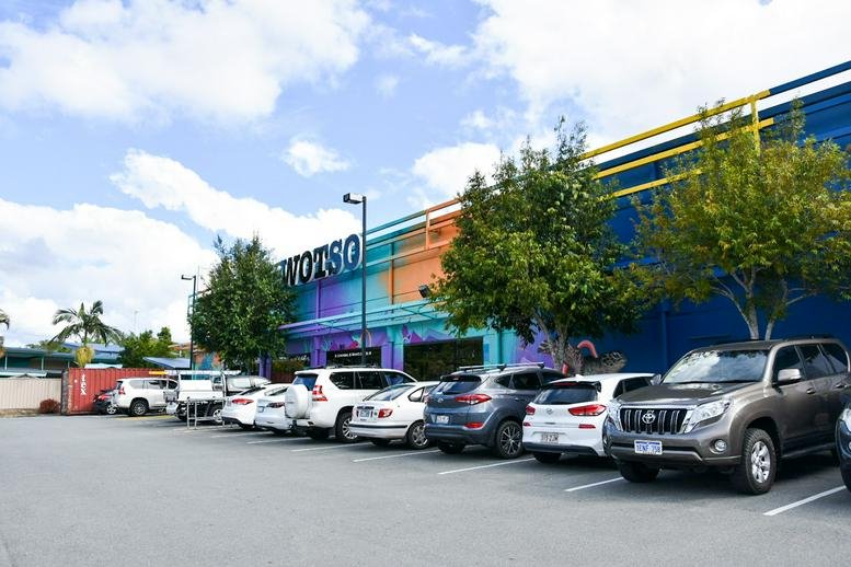 Exterior view of the colorful mural-covered WOTSO building at 30 Chancellor Village Boulevard.
