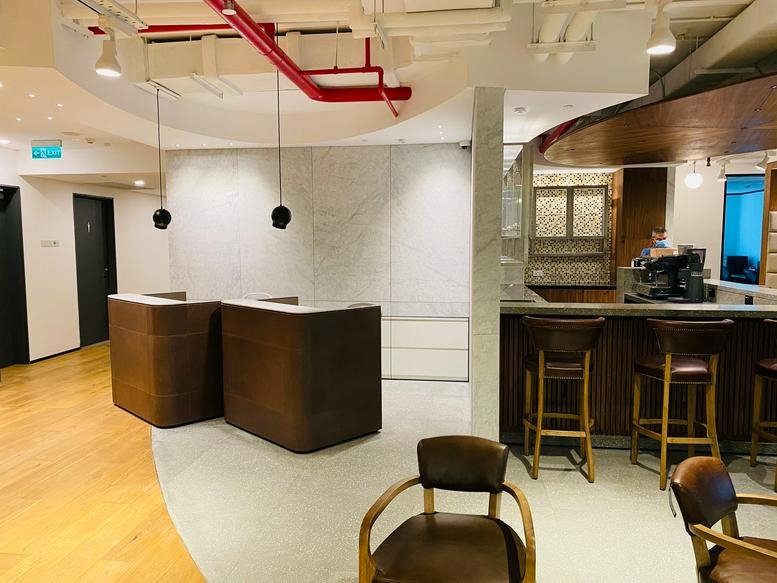 Spacious reception area with modern wooden desks at 31 Le Duan Boulevard, District 1, Ho Chi Minh City.