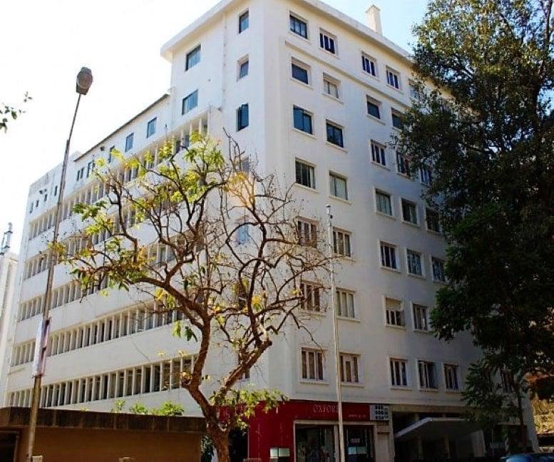 Exterior view of the white multi-story office building on Haddows Road, Nungambakkam.