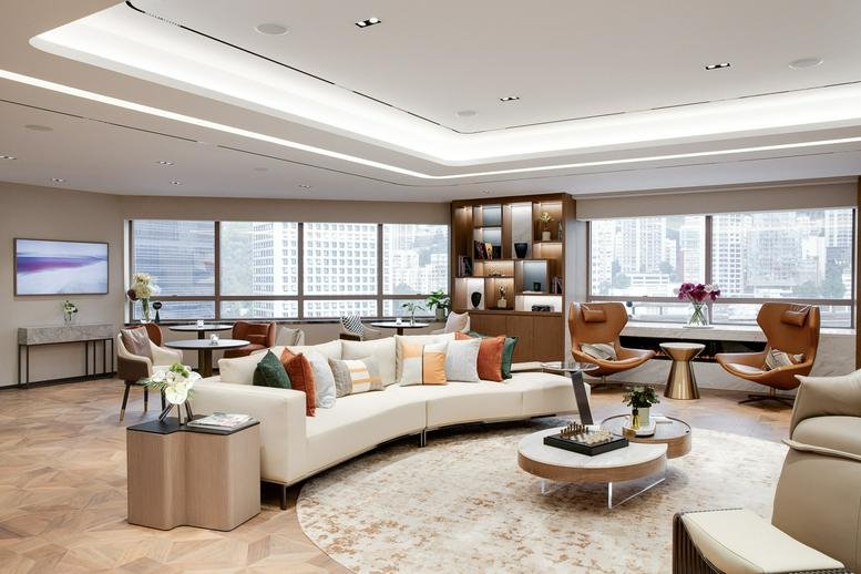 Elegant lounge at Level 18-19, 4-4A, Des Voeux Road Central with curved sofas and city panoramas.
