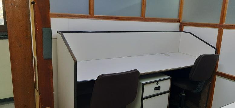 Two-person desk at 43 Palace Court with a small white pedestal drawer unit.
