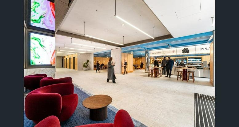 Bright, open reception lobby at 440 Collins Street, Melbourne, Victoria with red lounge seating.
