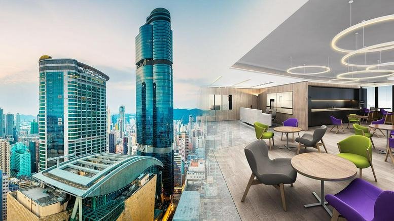 Exterior view of the iconic glass facade of the Langham Place Office Tower showing high-rise city views.