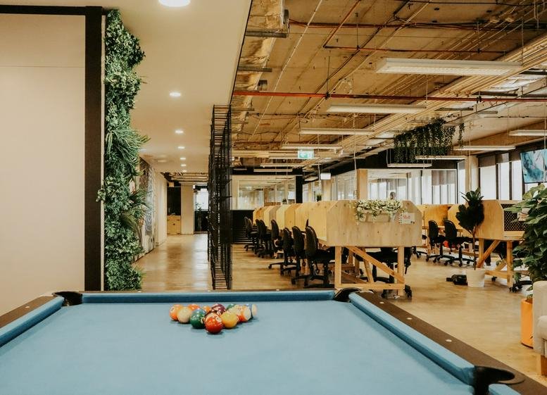 Spacious open-plan workspace at 490 Northbourne Avenue, Ground Floor, Dickson with a pool table and vertical garden.
