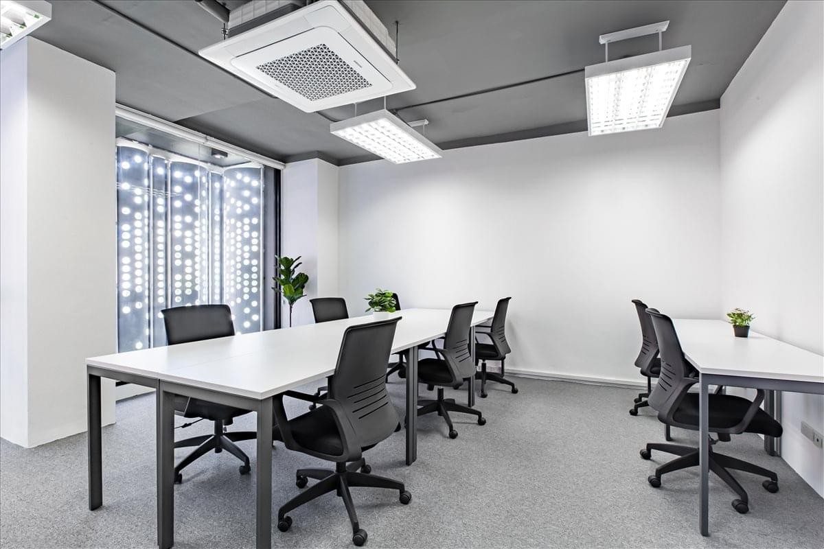 Bright team office space at 51 Sukhumvit 24 Alley with multiple workstations and modern overhead lighting.