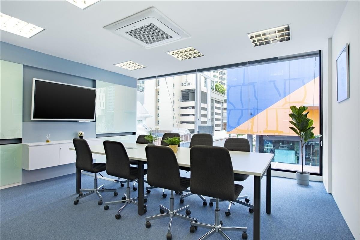 Professional boardroom at 51 Sukhumvit 24 Alley with a large table and floor-to-ceiling windows.