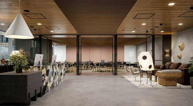 Spacious reception and lounge at 530 Collins Street, Levels 2 & 3 with warm wood ceilings and stylish lighting.