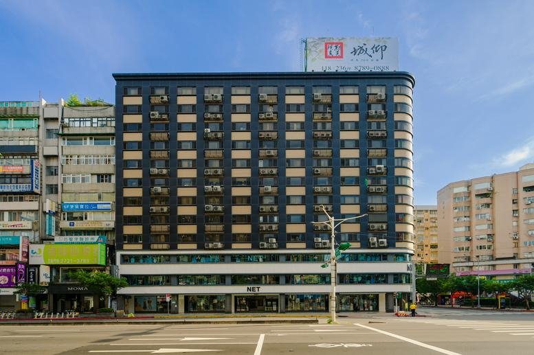 Exterior view of the dark-facade building at 59, Section 4, Zhongxiao East Road, Taipei.