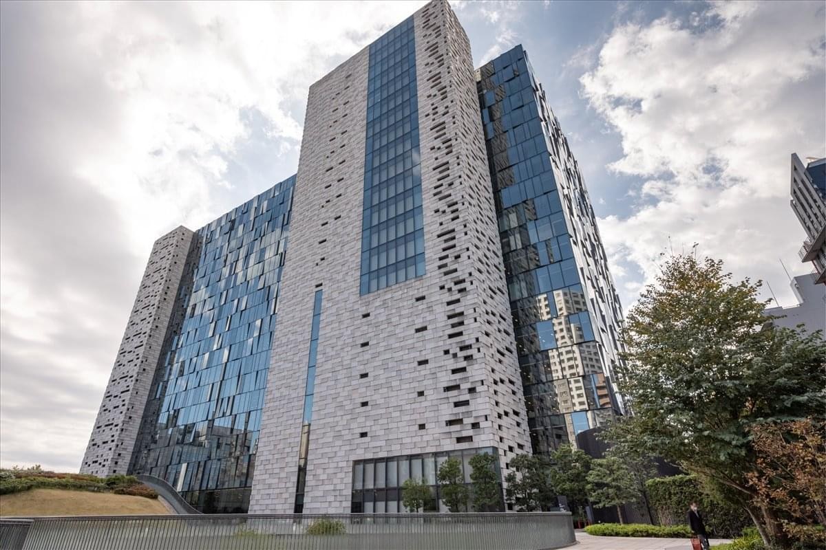 Exterior view of the modern geometric facade at Shinjuku Eastside Square.