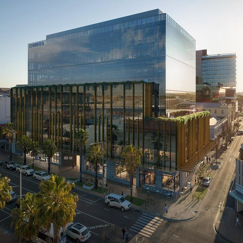 Exterior view of the modern glass-facade building at 60 Moorabool Street, Geelong.