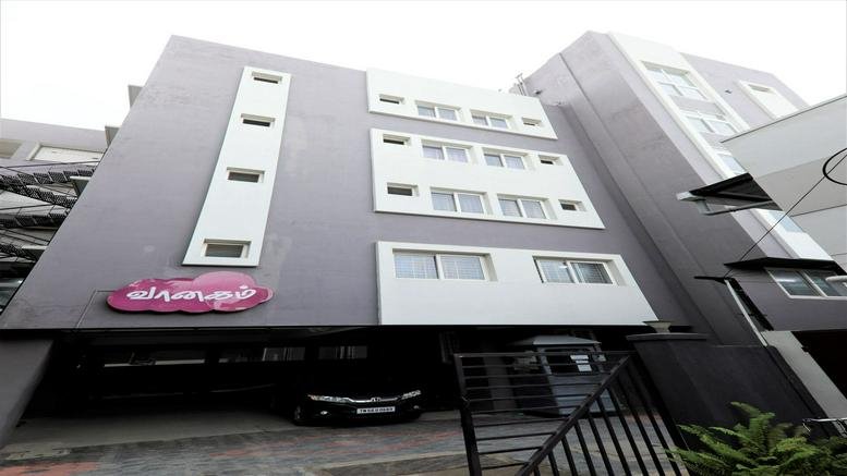 Exterior view of the multi-story building at 60, Vaanagam Road, Lakshmi Mills, Coimbatore.