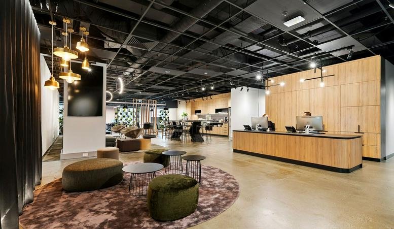 Spacious wood-paneled reception area and guest lounge at 607 Bourke Street, Melbourne.