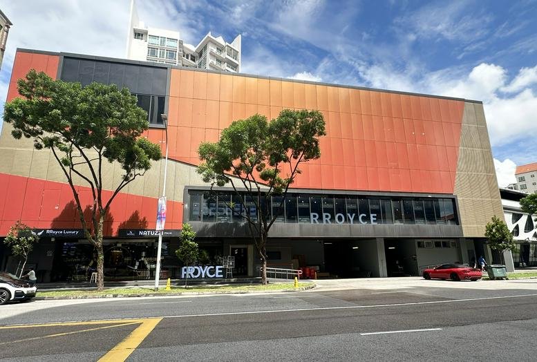 Exterior view of the colorful facade and entrance of 65 Mohamed Sultan Road.