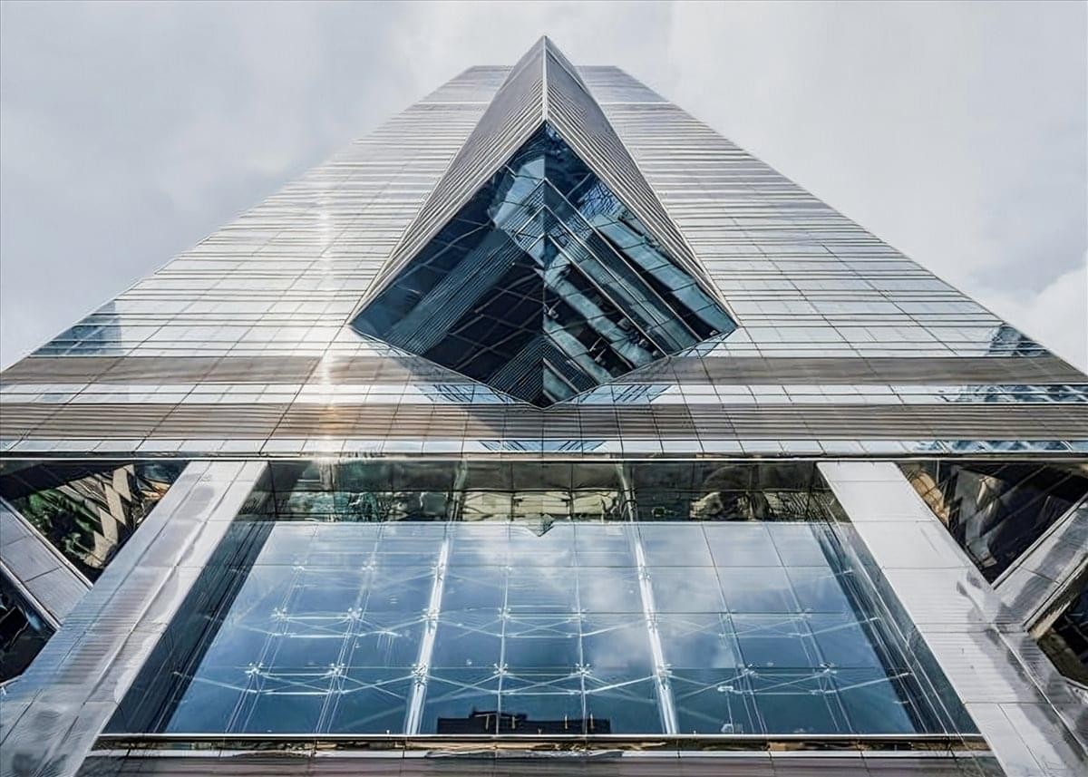 Exterior wide-angle shot of the soaring glass-and-steel facade of The Center.