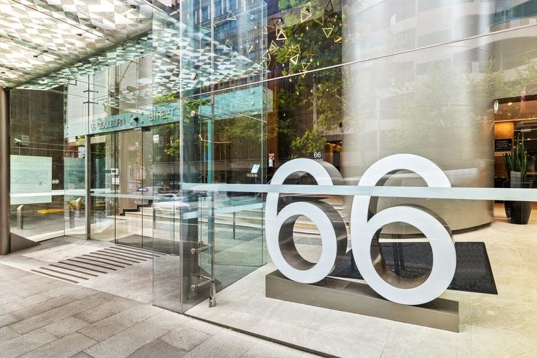 Building entrance of 66 Goulburn Street with glass doors and large decorative number sixty-six.