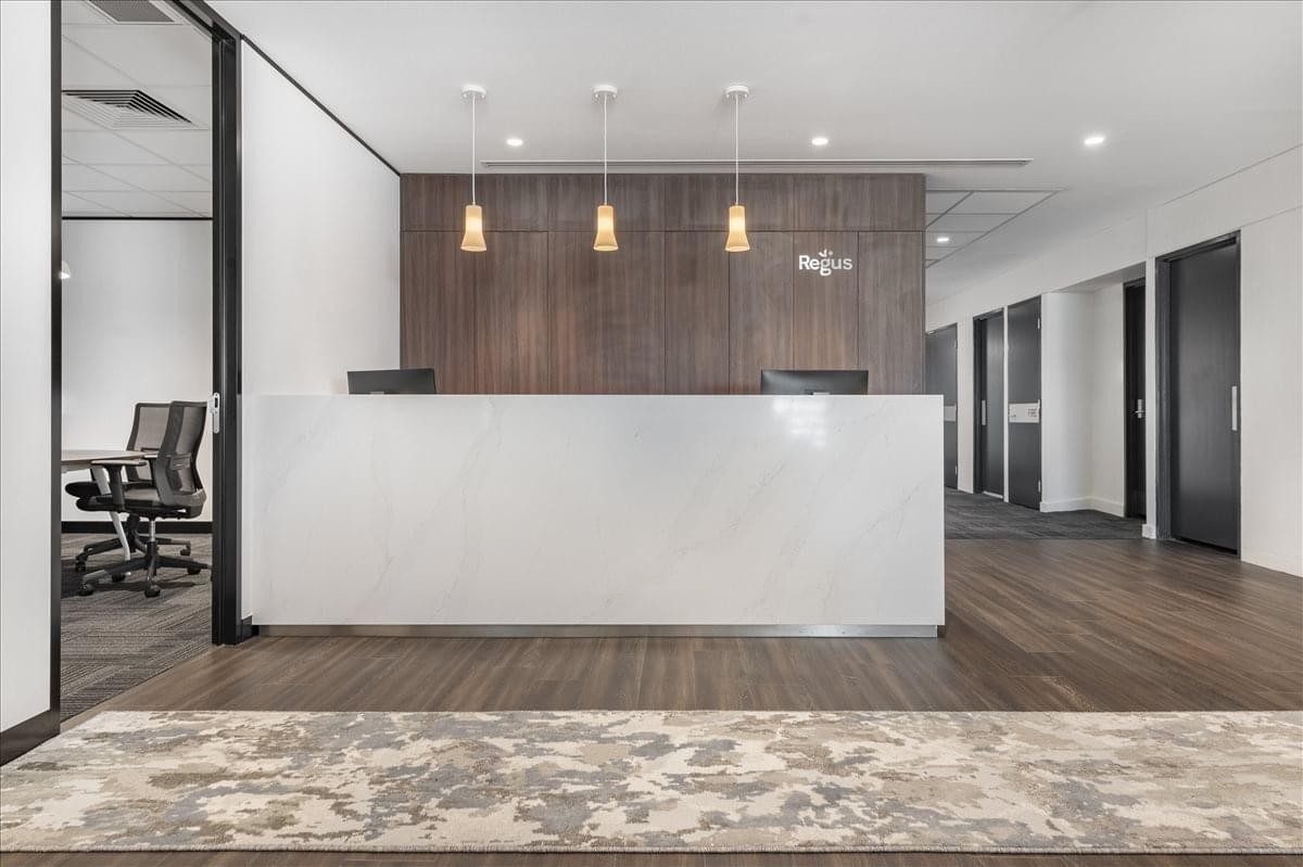 Bright reception area at 66 Smith Street, Level 4 and 5, featuring a marble desk and wood paneling.