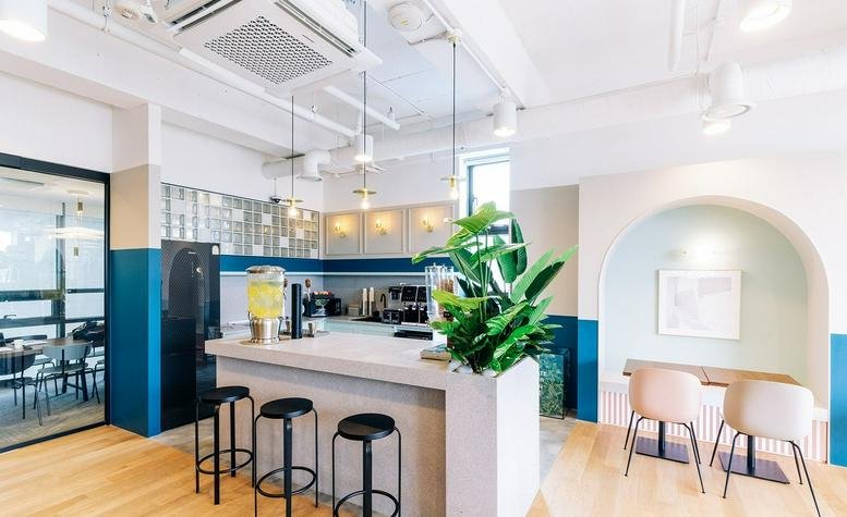 Bright communal kitchen area at 68, Achasan-ro, Seoungsu 1, Seoul featuring a breakfast bar and teal accents.