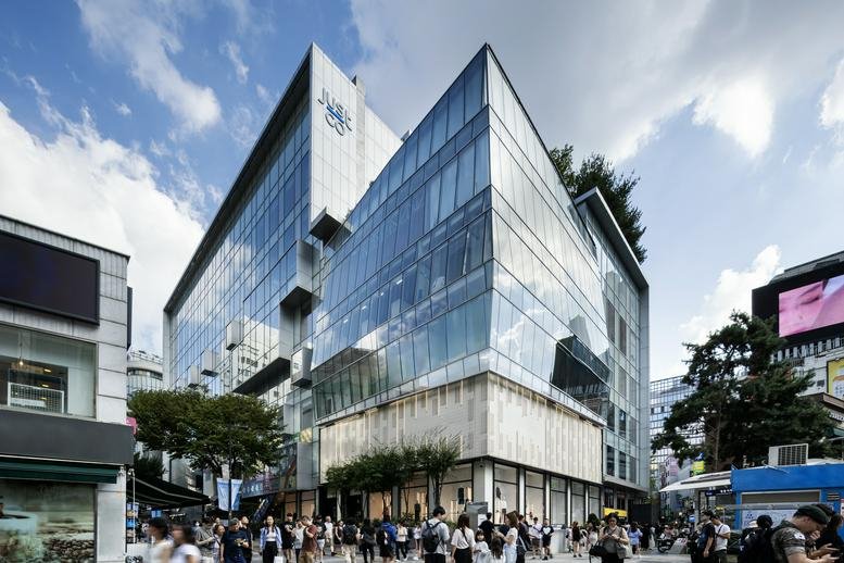 Exterior view of the glass-facade Noon Square building at 14, Myeongdong-gil.