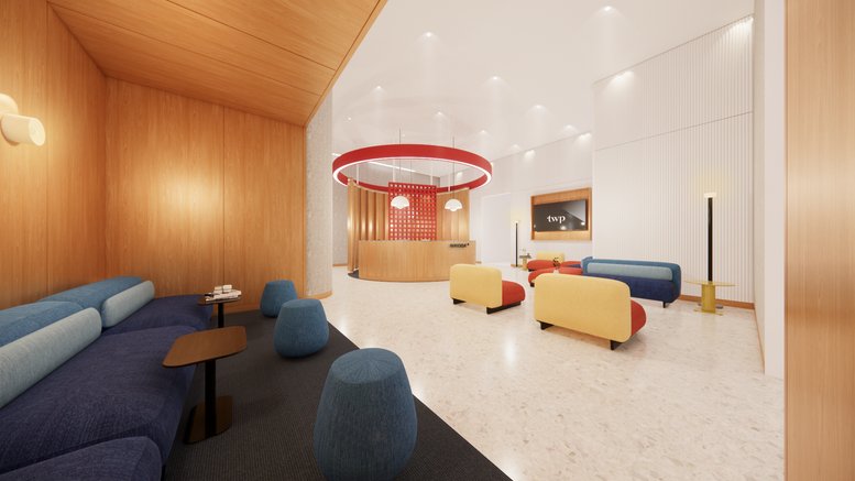 Spacious reception area at 7 Science Park Drive, No. 1, 5, Singapore with colorful furniture and a circular light.