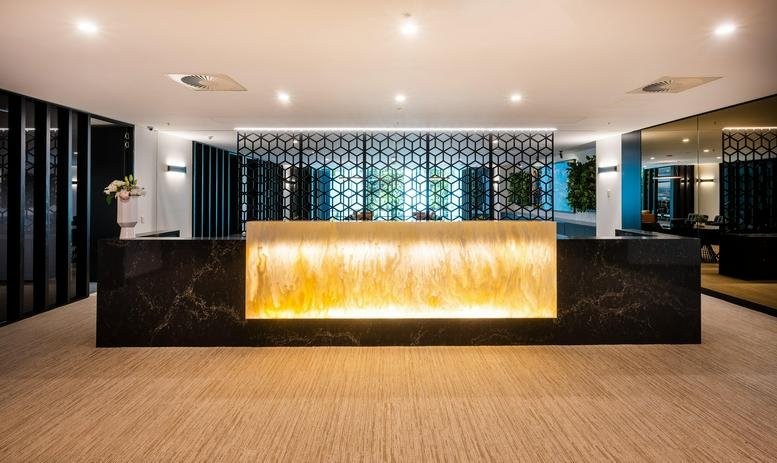 Reception area at 727 Collins Street, Level 17, Tower 4, Collins Square featuring a backlit stone desk.
