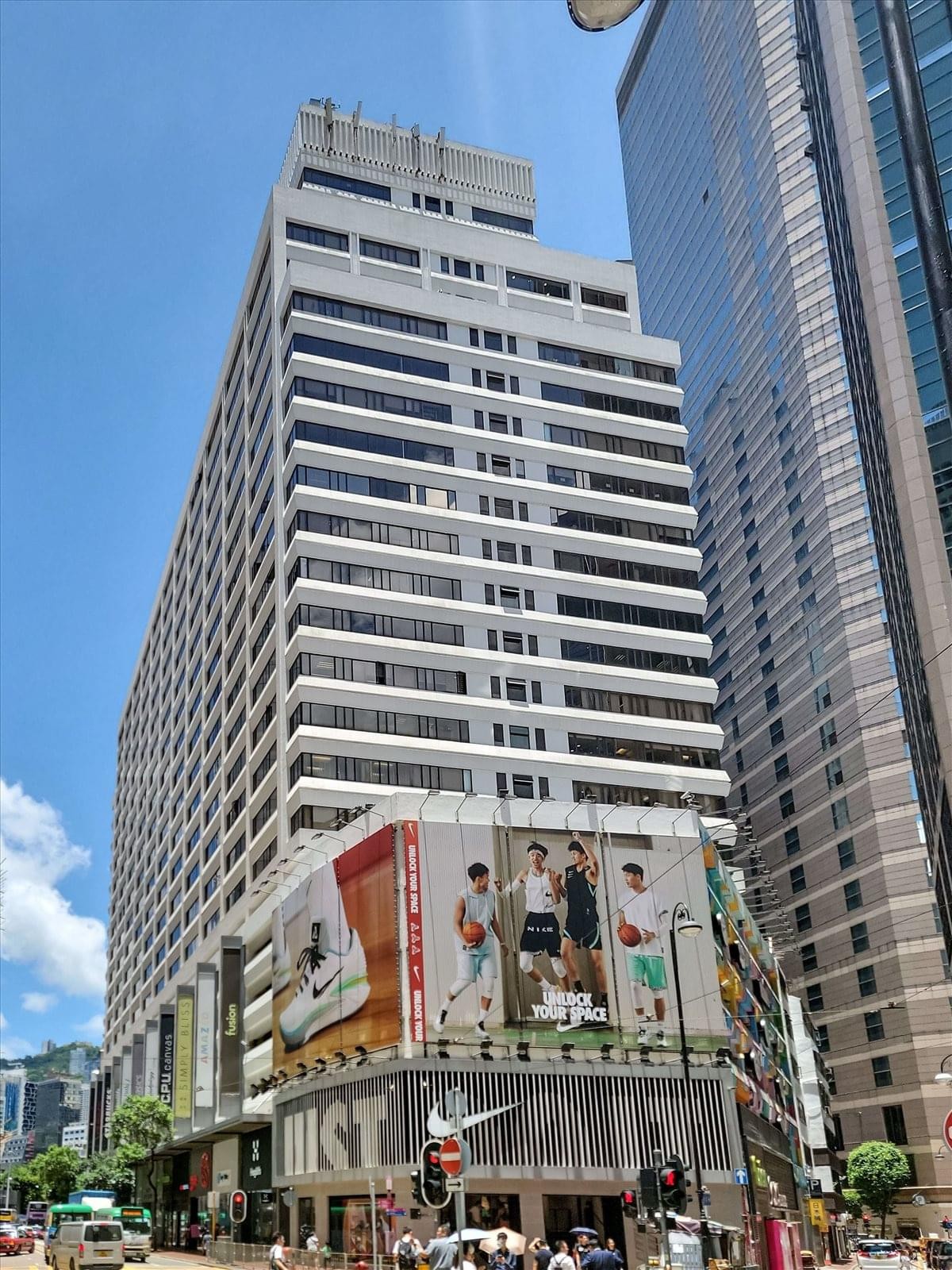 Exterior view of the white high-rise facade of Leighton Centre in Causeway Bay.