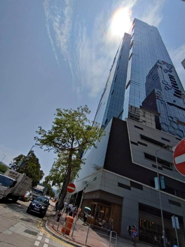 Exterior view of the modern glass-facade skyscraper King Palace Plaza.