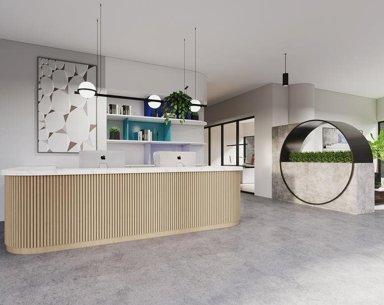 Modern reception desk with a wood-slatted front and marble feature wall.