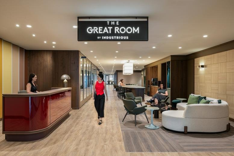 Spacious reception area with a red desk and signage at Level 29, 85 Castlereagh Street, Sydney.
