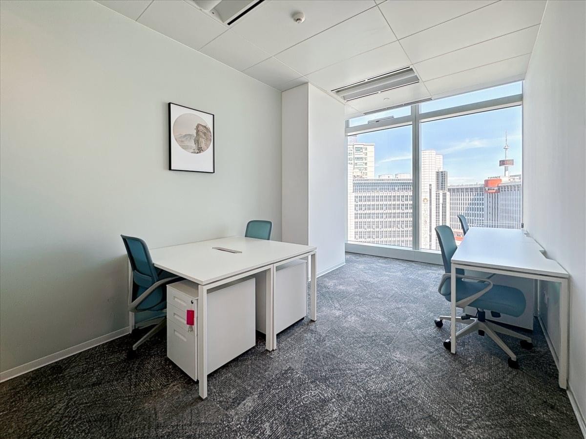 Spacious three-person office at 9 Xinquan South Road with large windows and city views.