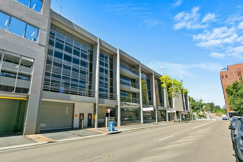 Daytime exterior view showing the modern entrance and architectural lines of 90 Phillip Street.