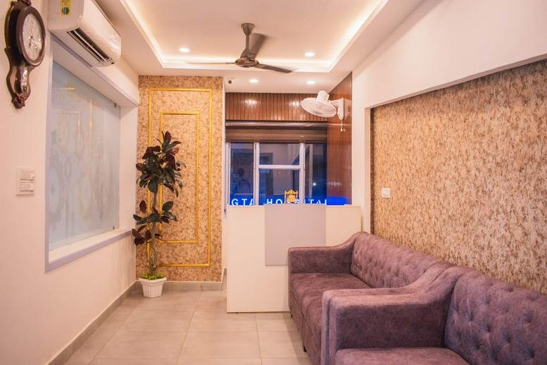 Warm reception area at A-660, Calgiri Road with a purple velvet sofa and feature wall.