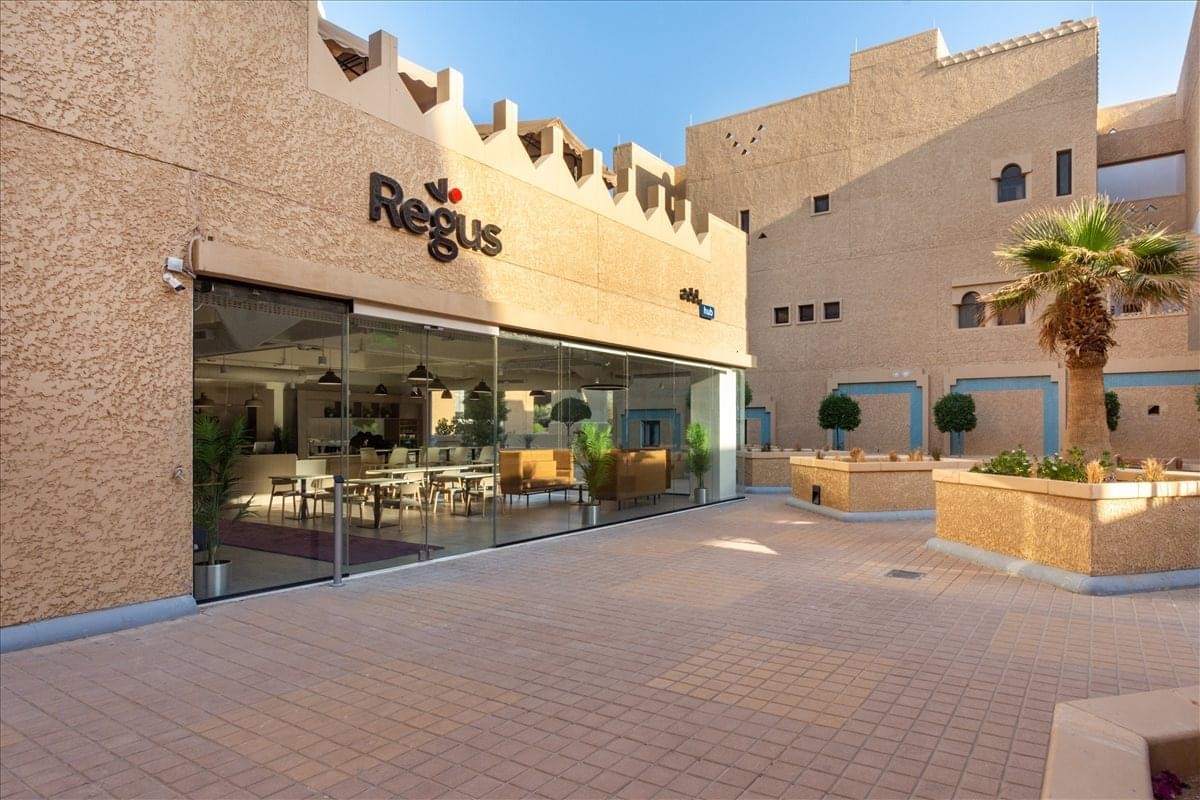 Exterior view of the traditional stone-facade building at Abdullah Alsahmi Street, Al Safarat.