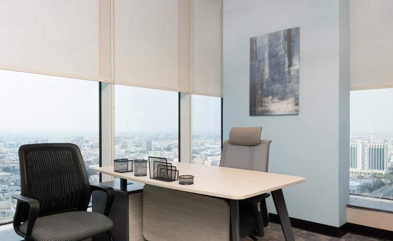 Executive office at Balhamar Business Tower with a sleek desk and floor-to-ceiling windows.