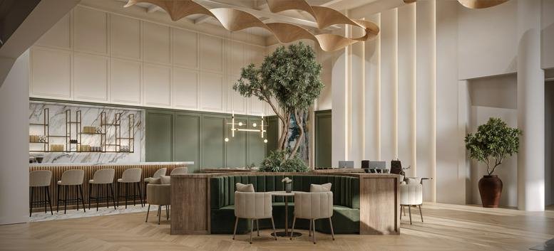 Spacious reception area featuring a tree centerpiece, curved wood ceiling, and coffee bar.